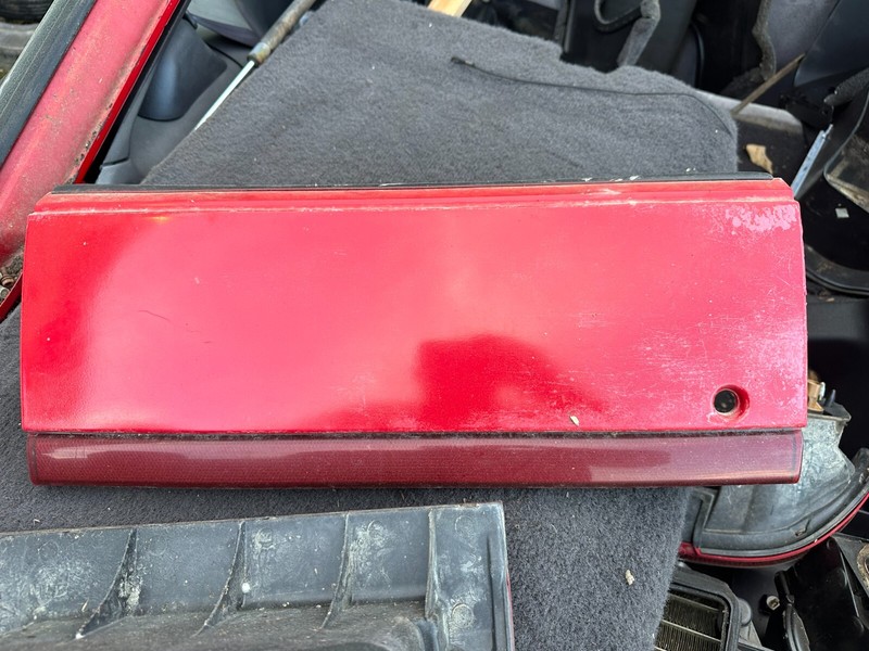 92-94 Plymouth Laser 1G 1GB CENTER TAIL FINISH PANEL - TAILLIGHT GARNISH
