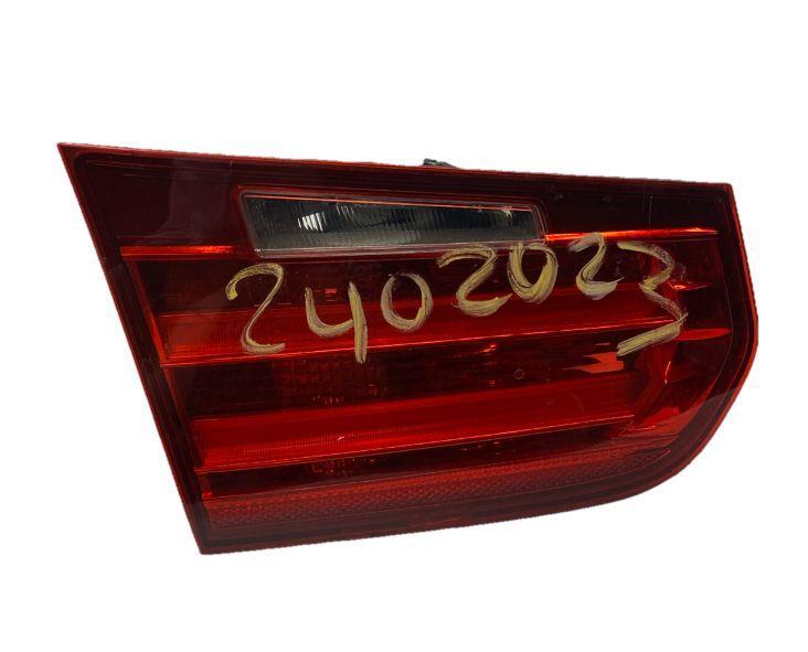 BMW 320 tail light 2014 to 2016 left side decklid mounted assy OEM 63217372793