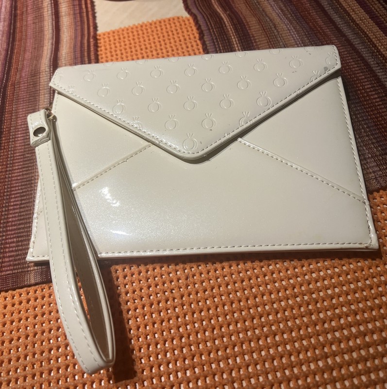 Pandora ivory clutch/wristlet.