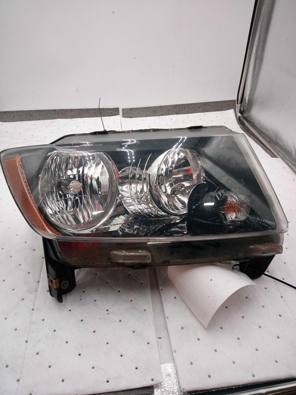 Used Right Headlight Assembly fits: 2016 Jeep Compass black bezel Right Grade B