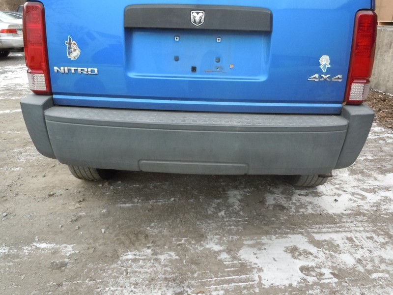 2007-2009 Dodge Nitro Rear Bumper Cover W/O Trailer Hitch OEM