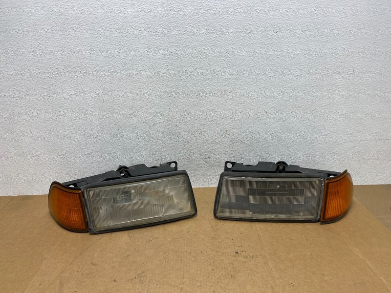 1989 to 1995 Plymouth Acclaim Left+Right Side Headlights AE3151 DW