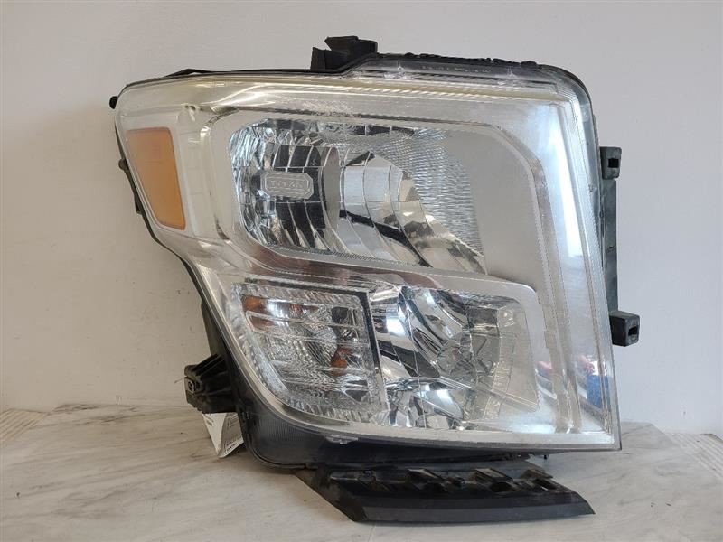Passenger Headlight Halogen Chrome Interior Bezel Fits 16-20 TITAN XD 575261