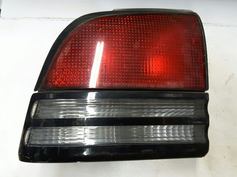 92 93 94 95 96 97 CUTLASS SUPREME L. TAIL LIGHT 4 DR 64086
