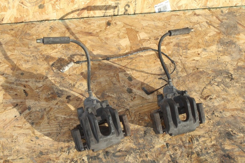 2002-2008 BMW 745 750 760 Rear Left & Right Brake Caliper Carrier Set OEM