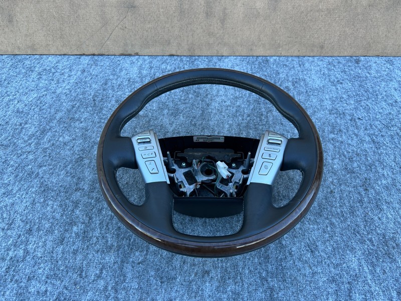 INFINITI QX80 QX56 2011-2017 OEM LEFT DRIVER WHEEL WOOD WITH SWITCHES ASSEMBLY