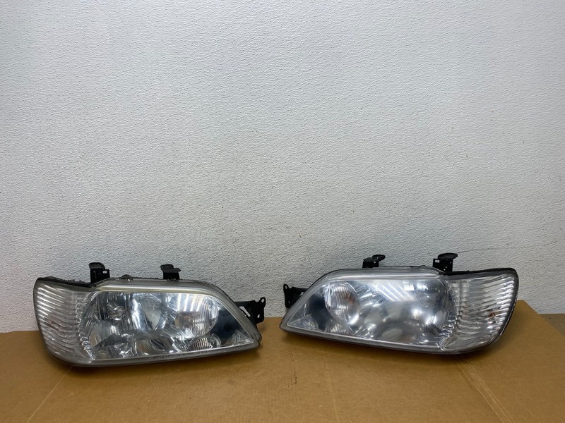 2002 - 2003 Mitsubishi Lancer Left+Right Side Headlights Halogen AD8939