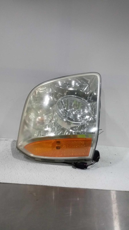 2007 GMC Yukon XL 1500 Right Headlight Assembly Gold OEM 420355 Used