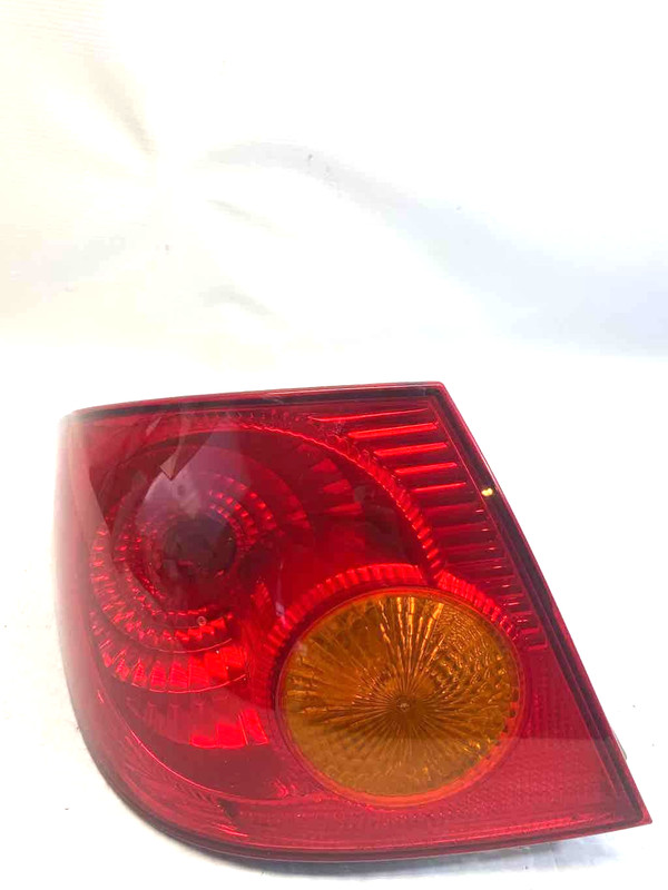 2006 Toyota Corolla LH Driver side Tail Light Quarter Panel Mounted 8156002290