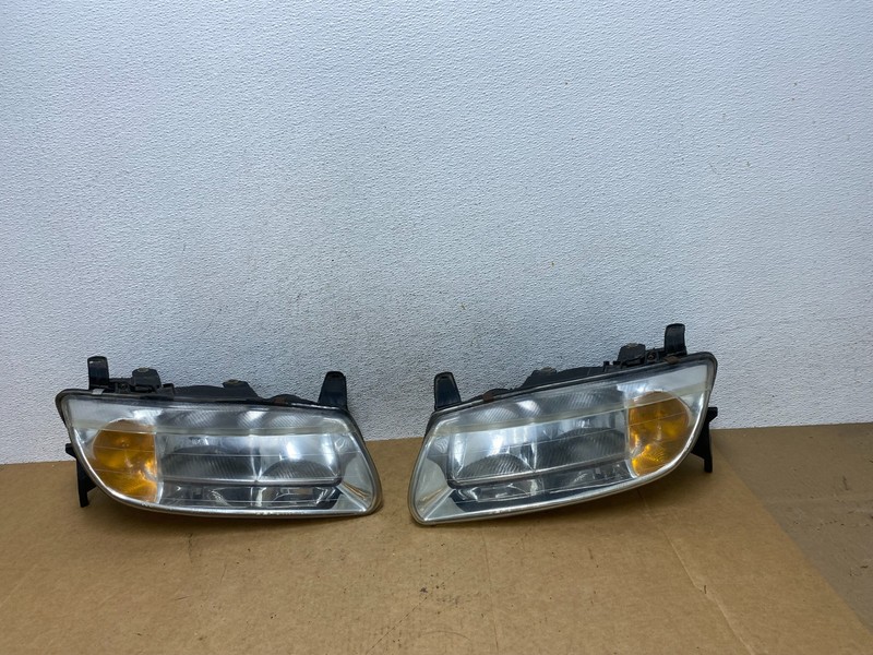 2000 to 2002 Saturn L Series Headlights Left+Right Side AE2945 DW