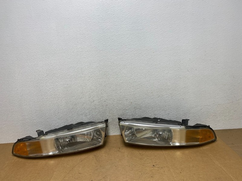 2002 to 2003 Mitsubishi Galant Left+Right Side Headlights AE3173 DW